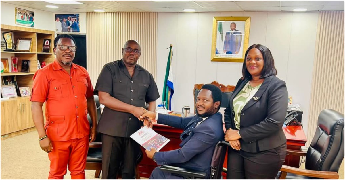 Law Clerk Sowe Presents First Session Report of the Sixth Parliament to Speaker Segepoh Thomas